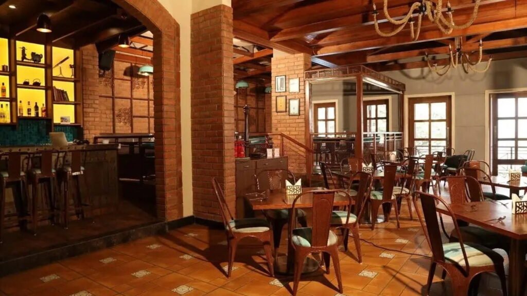 KA Lounge rustic brick interiors and seating among Live Music Restaurants in Sambhajinagar.