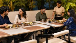 Friends and family enjoying Indian food at the Best Rooftop Restaurant in Sambhajinagar